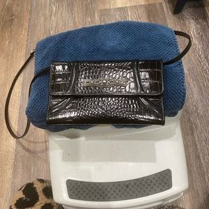 Brighton, black leather wallet, with strap, like new, carries ones.